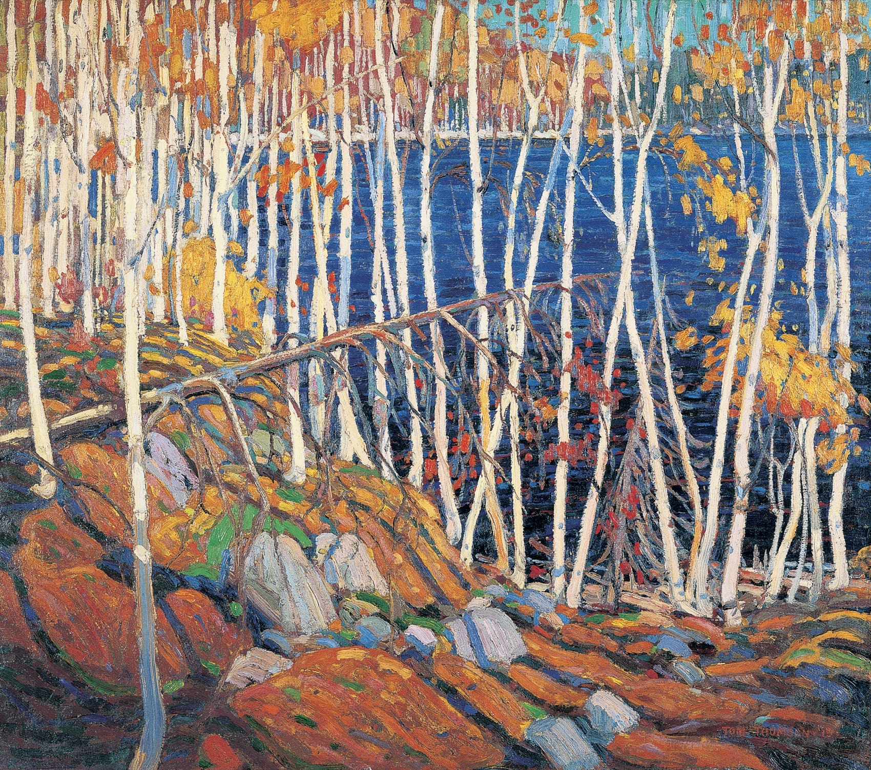 Painting of a forest with white birch trees, orange and yellow autumn leaves, and a deep blue lake in the background. Rocks and fallen branches cover the forest floor. The style is vibrant and impressionistic.
