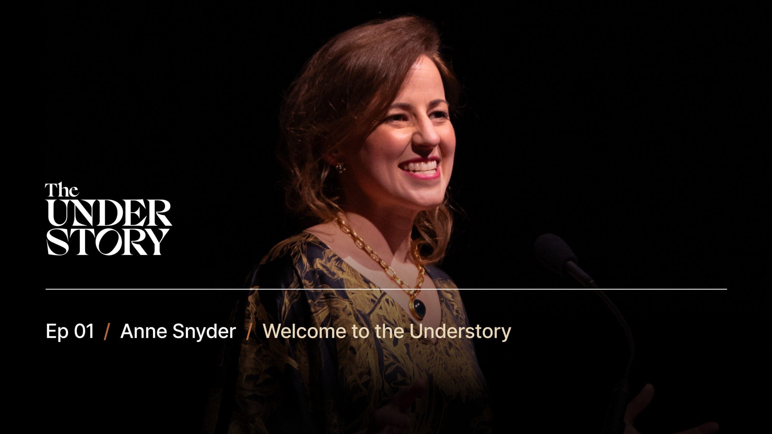 A woman with wavy brown hair and a patterned dress smiles while speaking at a microphone; text reads The Understory, Ep 01, Anne Snyder, Welcome to the Understory.