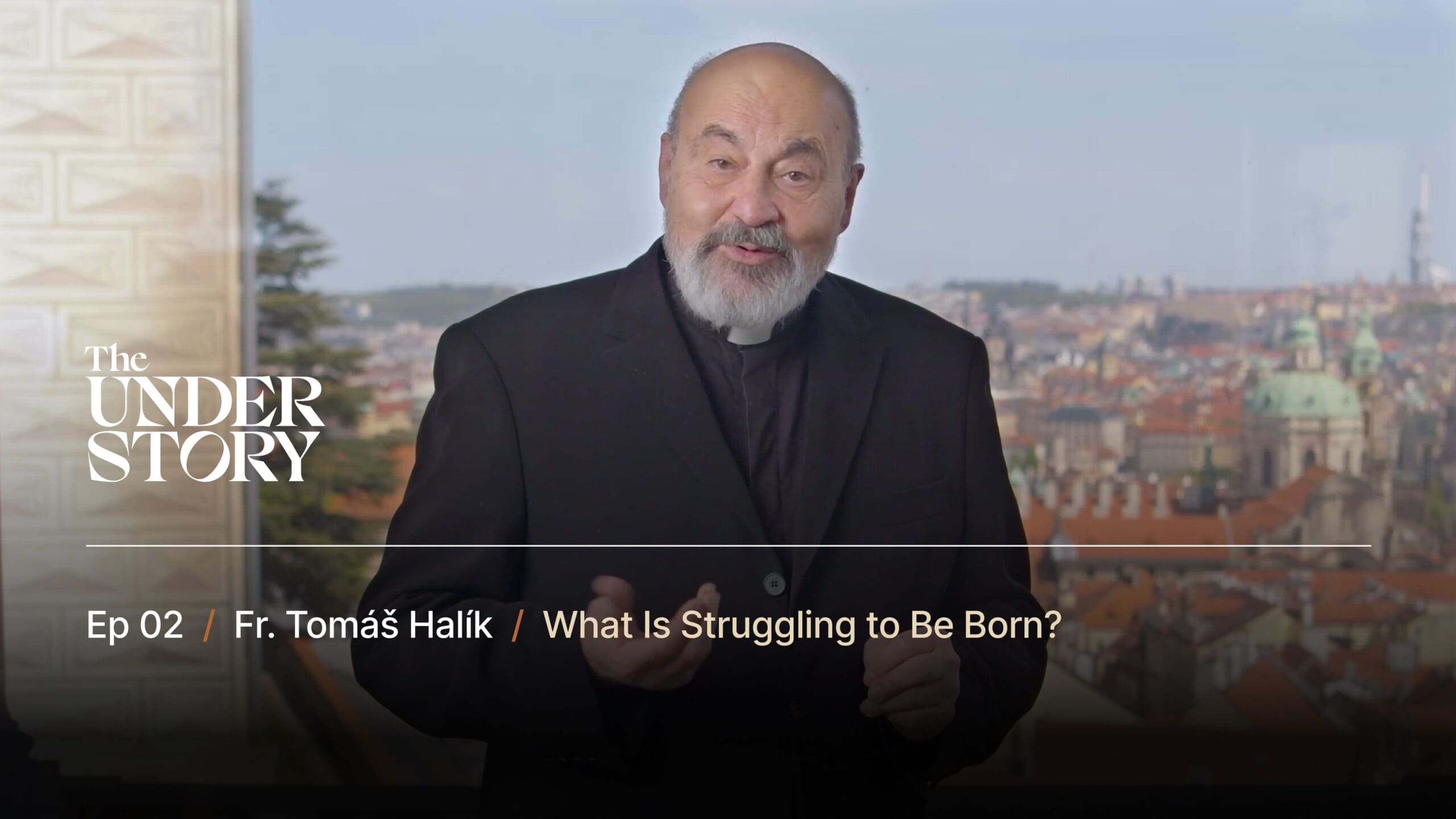 A bearded man in black clergy attire speaks in front of a scenic cityscape with historic buildings. On-screen text reads: The Understory, Ep 02, Fr. Tomáš Halík / What Is Struggling to Be Born?.