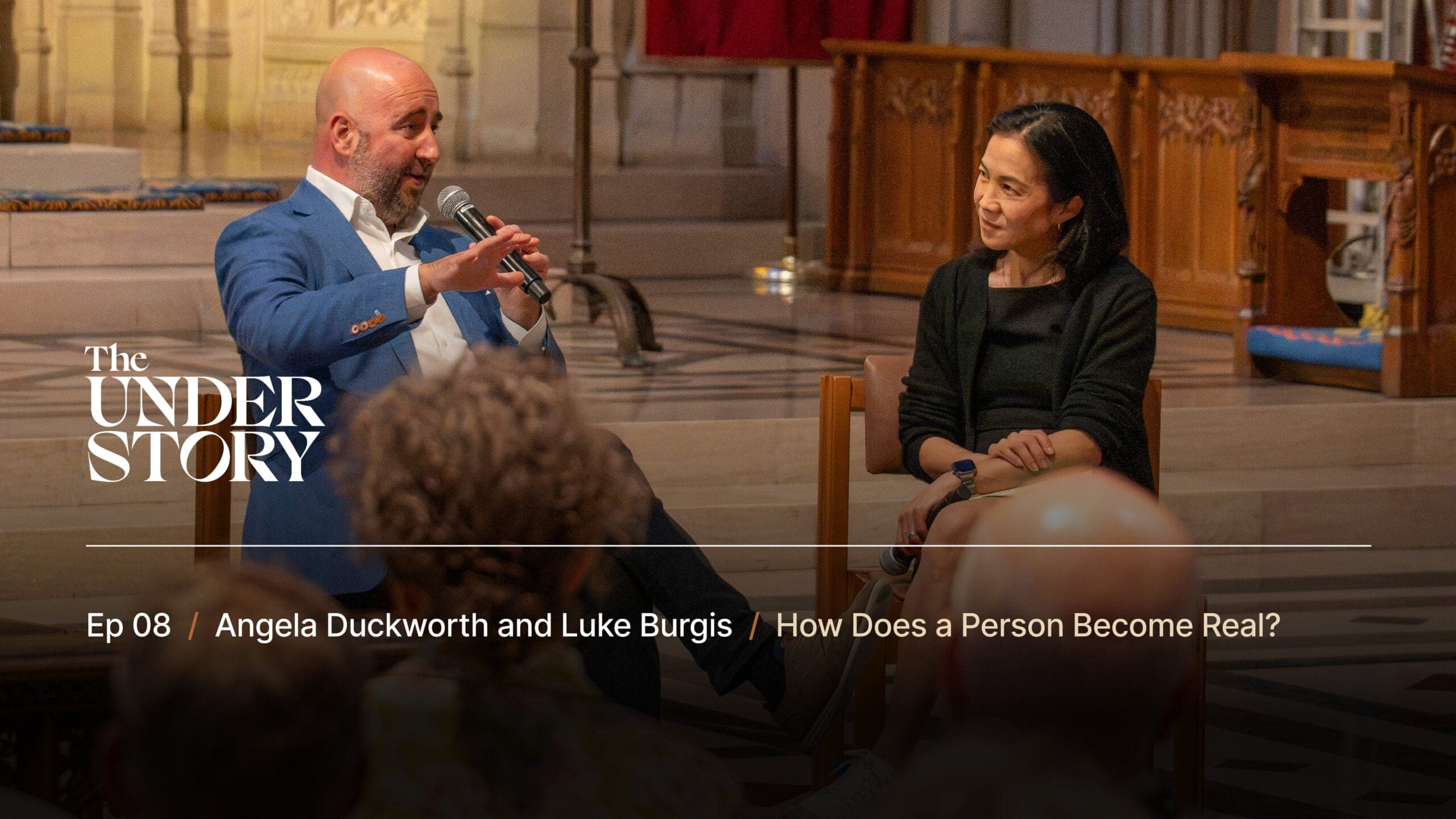 A man and a woman sit on stage, having a conversation in front of an audience in a church setting. Text on the image introduces “The Under Story” podcast, featuring Angela Duckworth and Luke Burgis.